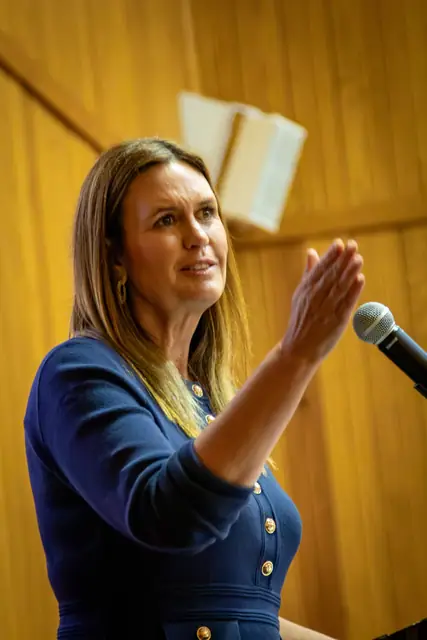 Governor Sarah Huckabee Sanders speaking at the podium during the Legacy of Liberty dinner