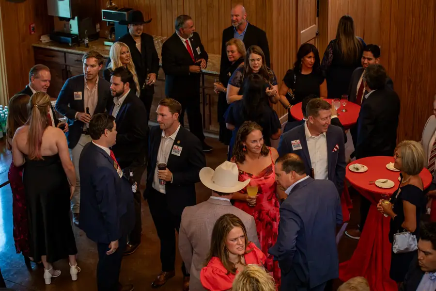 Guests talking in small groups during the reception at the Legacy of Liberty dinner